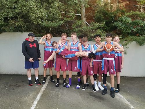 Junior boys basketball ham it up in Dunedin.