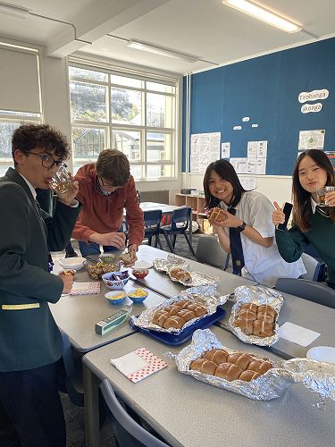 Andrea, Florian, Wansuk and Gain enjoying hot cross buns and jam