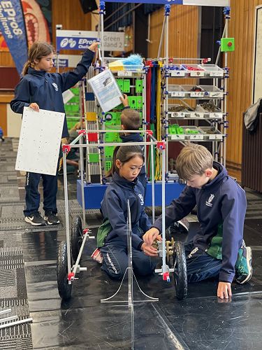 The Year 5 team work together to build their carwash frame