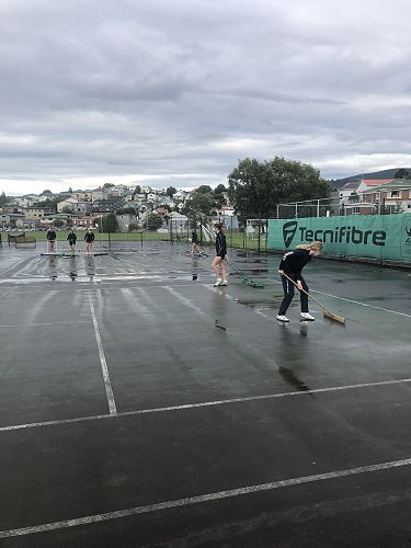 Hard at work to clear the courts for play 