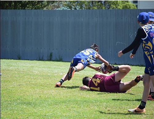 Orlando Tuhega-Vaitupu 7Mbe dives over to score a fantastic try for the Otago touch team. 