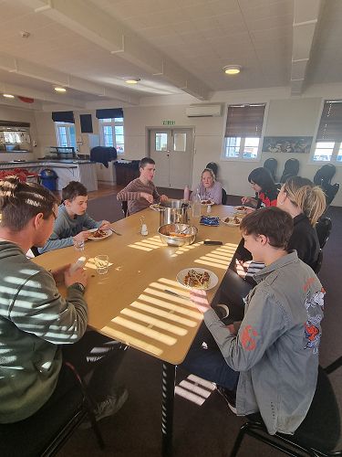 COMCOL group enjoying club sandwiches for afternoon tea