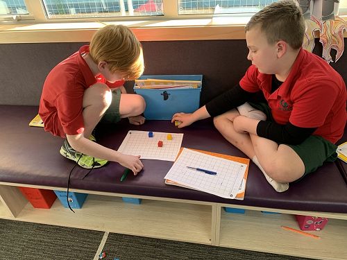 Arden and Macklin guiding Maui around the grid to collect flax.