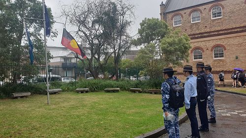 Our flag bearers raising our flags following the ceremony