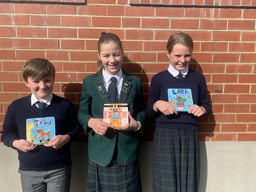 Toby Guy, Eden Walker, Lara Lowe with their finished tiles.