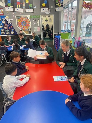 Year 9 class sharing their stories with Year 1-2 Students