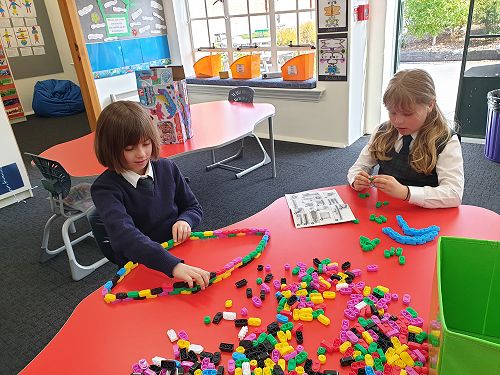 Ashiya and Maia focusing on their build