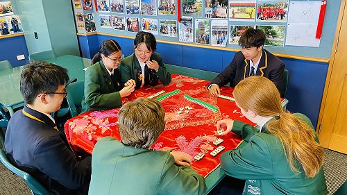 Year 12 students playing maijang