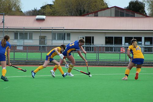 Annie and Peyton defending Madi in a penalty corner