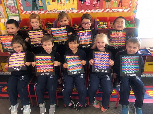 Year 0-1 class showing off their art.