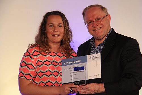 Kirsty Havill receiving her Lincoln University Blue for Clay Target Shooting from Vice Chancellor Robin Pollard