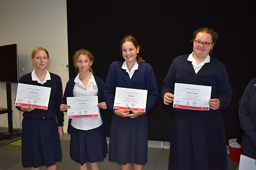 Students from 9CLJ receiving certificates for participating in a joint online research project with a Thai high school. 