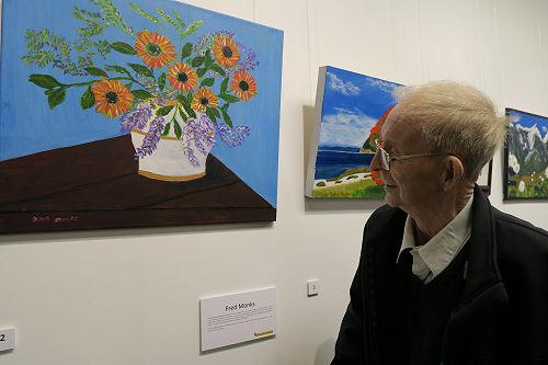 Resident Fred Monks taking a look at his exhibited