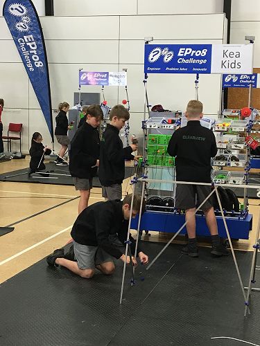 Kea Kids working on their design, with the Pukeko Pack in the background