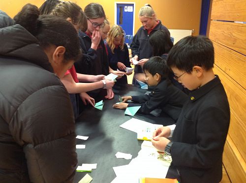 The boys taught us how to fold origami cranes.