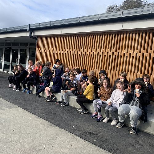 Rūma tekau celebrating the opening of the new school with ice cream 