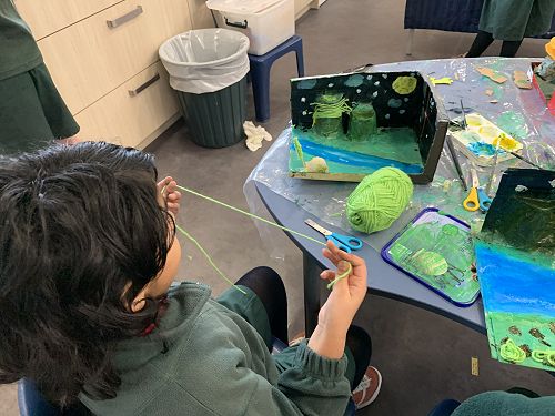 Briti working on her diorama