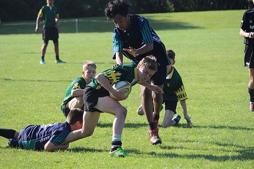 Zach Arundel fighting through the tackle for rugby 7s