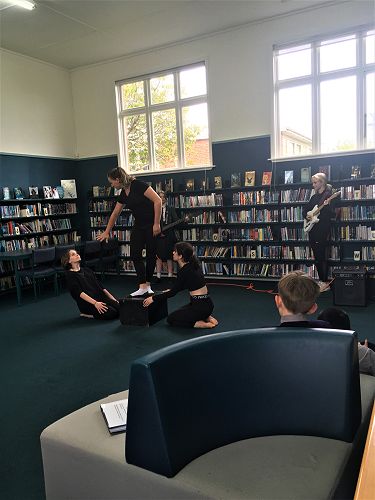 Raheli, Lois, Jessica, Sophie, Keren, Aoife (music), Emily (music), performing their Shakespeare piece in the library.