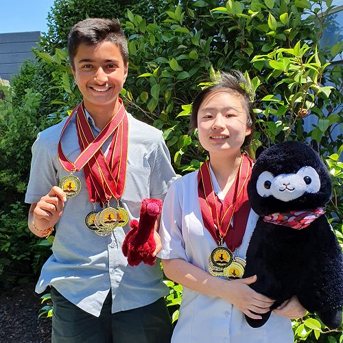 Ameya Raut 9SOSC and Lucia Guo 9SHTR with their medals from the World Scholars Cup Tournament of Champions.