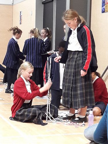 3rd Place Winners, Zoe Thomson, Isabella McNeill, Godwin Delliha N'Zonou and Mihana Hof constructing their challenge device at the Great Christchurch Technology Challenge.