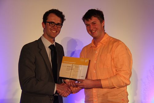 Danyon Thomas presenting Nick Beattie with his Gold Award for University Life