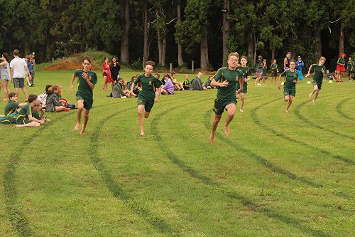Junior Boys 200m, from left: Eli Brydon, Dawson Salmons, Zach Arundel in front, Jack Tidman, Luke Spurr and Jack Wynne on the bend