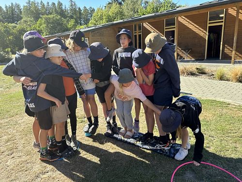 This group having to get across the river as a team. This team had a great strategy!