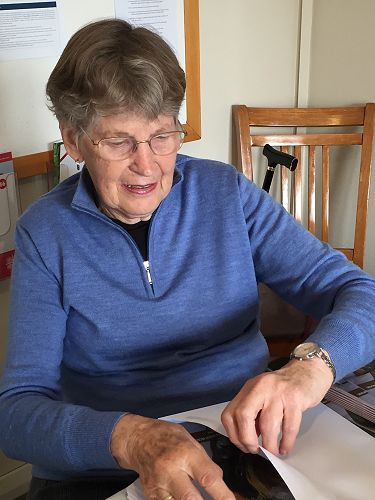 Maureen Smith packing the November 2022 issue. (31 October 2022)