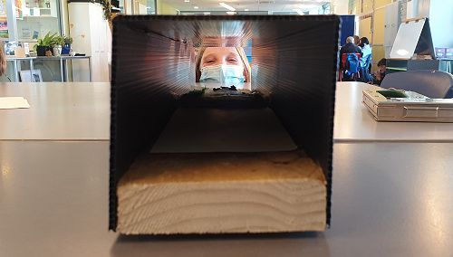 Amy Eason (Y9 Wairere) takes a cheeky photo of a tracking tunnel containing an ink card and peanut butter lure.