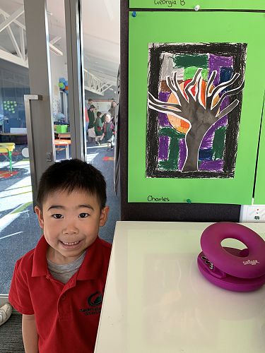 "I liked the tree because I can glue it on and the moon is in the middle. I can see part of the moon. I am proud of the colouring!" - Charles 