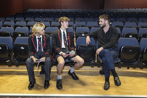 Dan Pega, left, and Daniel Cowan with old boy and musician Chris Starr.
