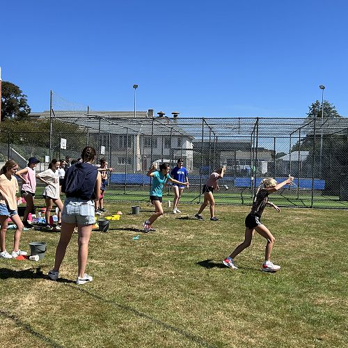 Florence and Isla compete against St Hilda's students in the relay.
