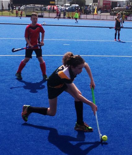 Ariana Temple takes a pass in 6 aside Hockey
