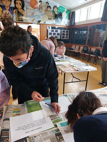 Luka Campbell sketching out his design for his Clay Art at Kit Day