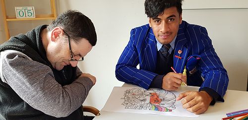 Ricky doing colouring in with his new Tongan friend - Rocky