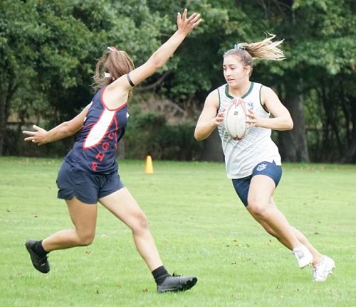 Meg Sycamore running the ball against Christchurch Girl's High School.