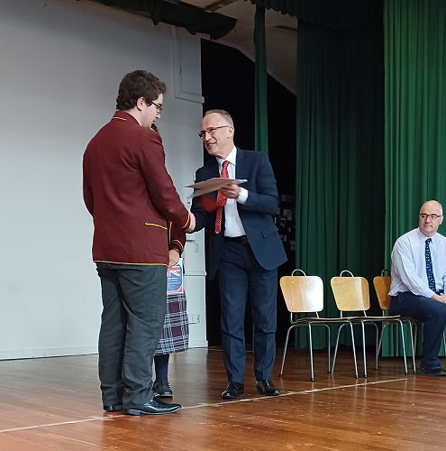 Trey receiving his grant from Mr Noble-Campbell
