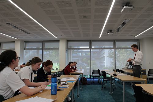 Columba College 1 listen to a James Hargest College speaker and prepare to interject and respond