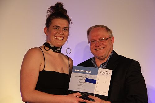 Connie Poletti receiving her Lincoln University Blue for Basketball from Vice Chancellor Robin Pollard