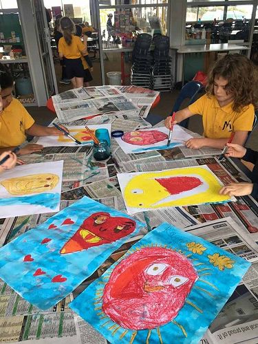 Room 10 made posters representing 'happy'