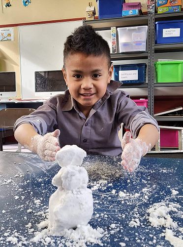 Sio making a snowman after a Science experiment, learning how to make snow