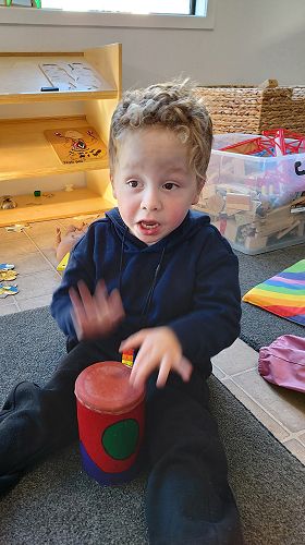 Nico enjoys playing a drum