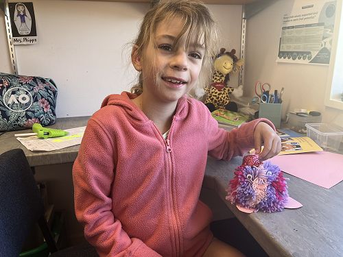 Scarlett and Snowy her pompom
