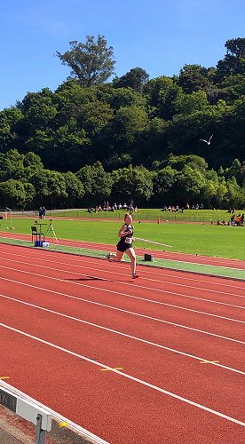 Faith Courtney striding ahead on the track