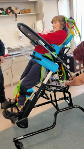 Charlotte is learning to put weight through her feet for standing.