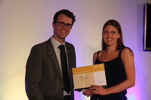 Danyon Thomas presents Libby Twiss with her Gold Community Engagement Award