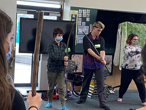 Ra Edmonds and Will Irvine exploring the use of Rākau in a workshop on Māori Performing Arts