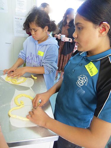 Language Day in Moerewa - Sindi & Reikura making symmetrical biscuits