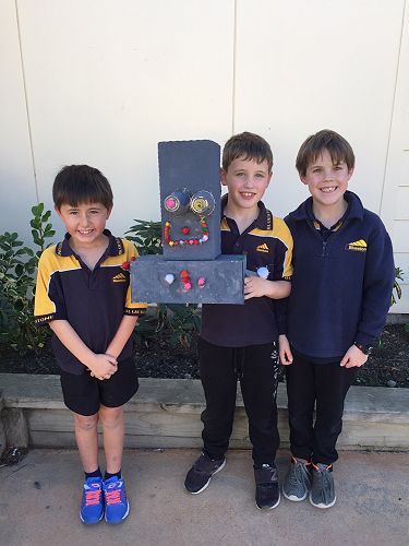 Tyler, Zachary and Callum with their robot, MegaRobot2000.